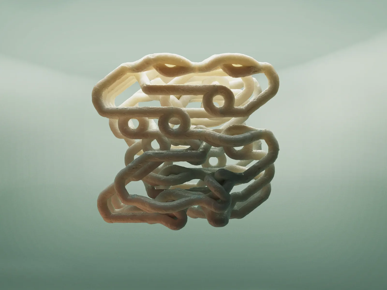 Sculptural object assembled from curved modules, with warm and teal material tones.